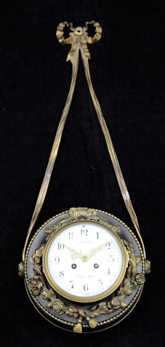 A French bronzed and gilt metal wall clock, 28in.